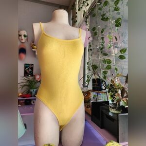 Yellow body suit!